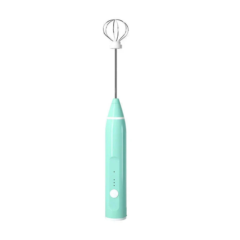 Electric Hand Mixer - mint green handheld whisk unit with metal balloon whisk attachment on white background