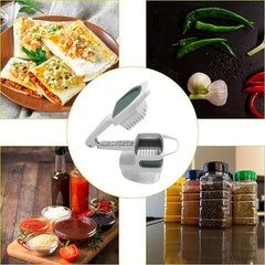 Vegetable Slicer - White handheld slicer tool centered in a circle, surrounded by cooked wraps, fresh peppers garlic, sauce bowls, and spice jars