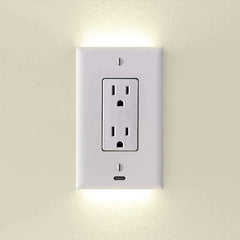 White wall electrical outlet with built-in LED night lights on beige wall