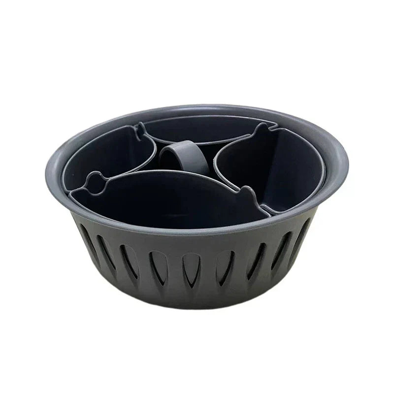 Egg Boiler - Dark gray round plastic basket with three removable inner dividers and slotted side walls, on a white background.