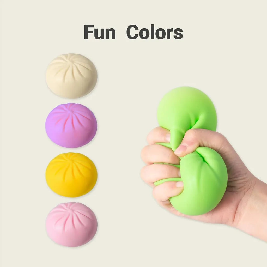 Fun colors of steamed bun squishy toys: beige, purple, yellow, pink, and green being squeezed