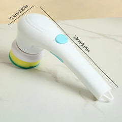 Scrubber Brush - White electric scrubber with a yellow-green sponge head, length marked 23cm/9.05in, head width marked 7.3cm/2.87in, on a marble-patterned surface