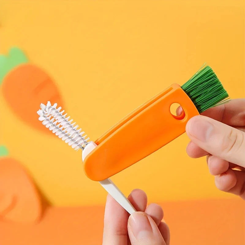 Bottle Cap Cleaning Brush Tool - Held carrot-shaped cleaning brush with fold-out white bristle brush, bristle side up, against orange background with carrot illustrations