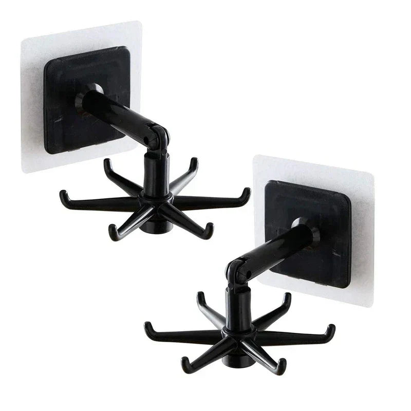 Adhesive Utensil Holder Hooks - Two black adhesive wall hooks with six-prong rotating ends and hinged arms, shown against a plain white background