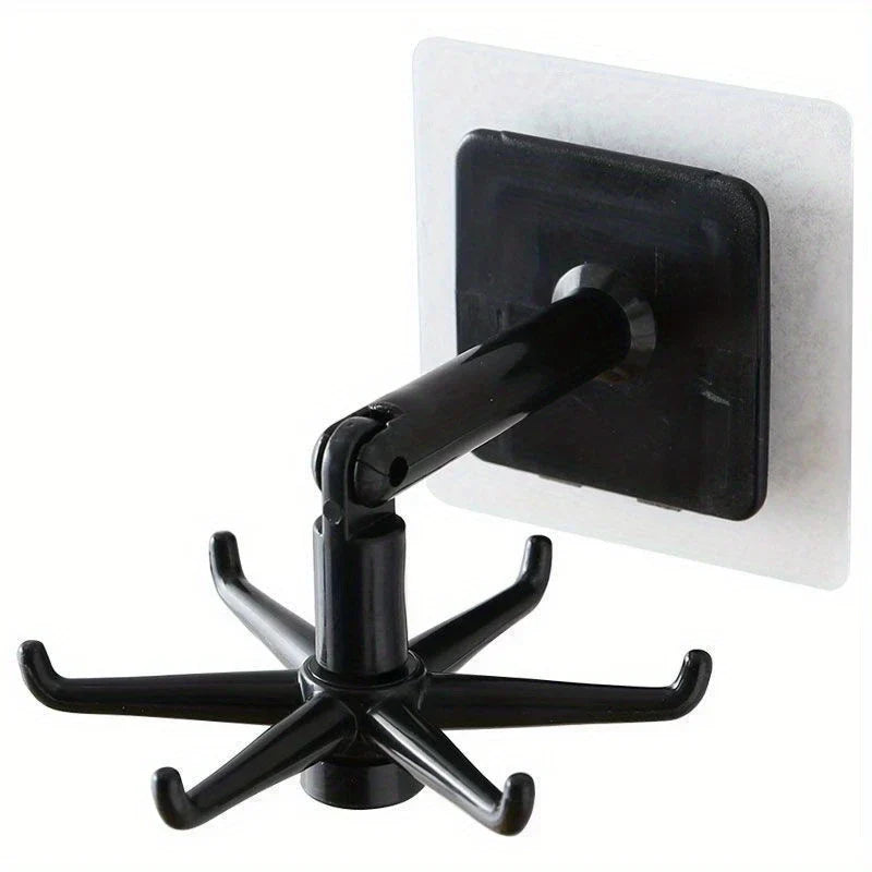 Adhesive Utensil Holder Hooks - One black adhesive wall hook with a six-prong rotating end and hinged arm, shown against a plain white background