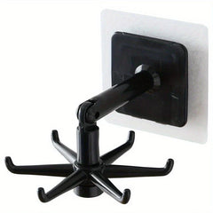 Adhesive Utensil Holder Hooks - One black adhesive wall hook with a six-prong rotating end and hinged arm, shown against a plain white background