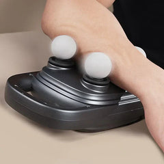 Mini Percussion Massage Gun - person resting forearm on vibrating round massage heads of dark gray device