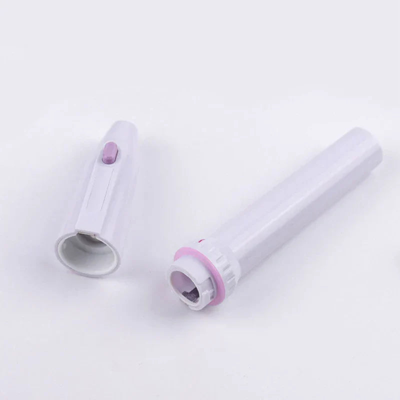Electric Nail File Manicure Kit - Two separated sections of a white plastic device with pink details, on a plain white background