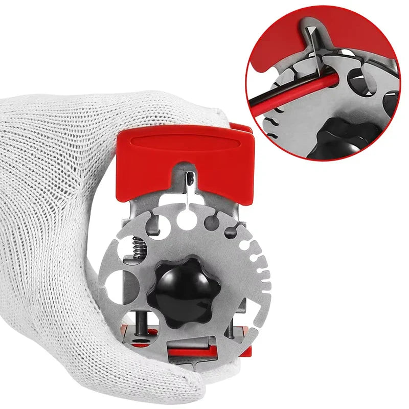 Handheld Wire Quick Stripper - A gloved hand holding a red and silver hand tool with a close-up inset of its blade acting on a red rod