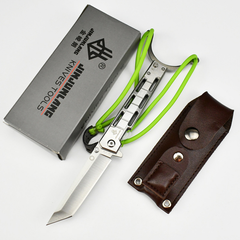 Silver edc folding knife with green elastic straps, beside its box and brown leather sheath on a white background.