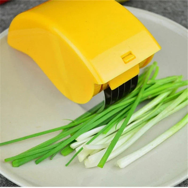 Pizza Dough Cutter Slicer - yellow 6-wheel slicer cutting green onions on white plate
