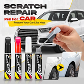 Scratch repair pen being applied to a car door scratch