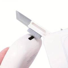 Electronics Cleaning Kit - White and grey cleaning tool with a small brush cleans the charging port of a white earbud case held by a finger