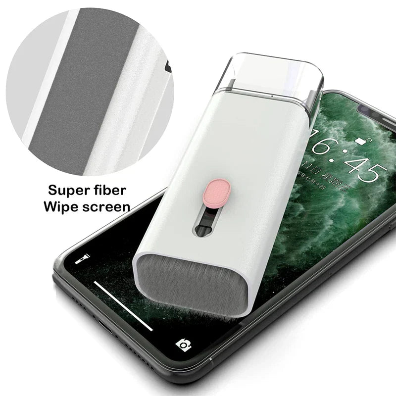 kit de cepillo limpiador para teclado - Herramienta de limpieza en blanco y rosa descansando sobre un teléfono inteligente, con un recuadro de primer plano de su superficie de paño de microfibra para pantallas