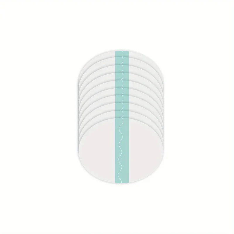 Slimming Belly Patches - Stack of white oval adhesive patches with light blue center strip on plain white background
