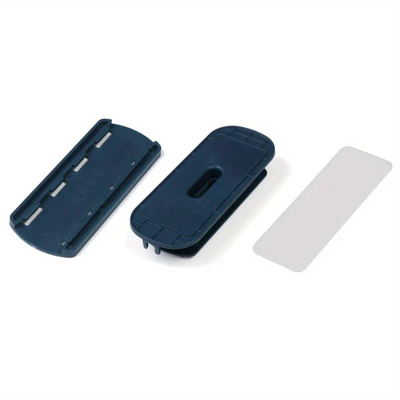 Power Strip Holder - Two dark blue plastic clip-like components and one thin rectangular light gray plastic piece laid out on a white background