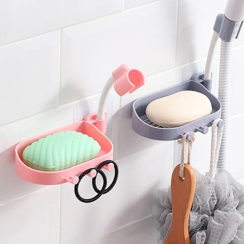 Shower Head Holder - Pink and gray wall-mounted soap dish brackets with hooks on white tile