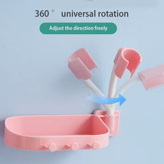 Shower Head Holder - Pink soap dish with three hooks and an adjustable arm that rotates 360 degrees, against a light blue background