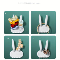 Utility Hooks - Four-panel grid showing the rabbit organizer holding scrunchies, a headband, hair clips, and a watch with earrings hanging from its pegs