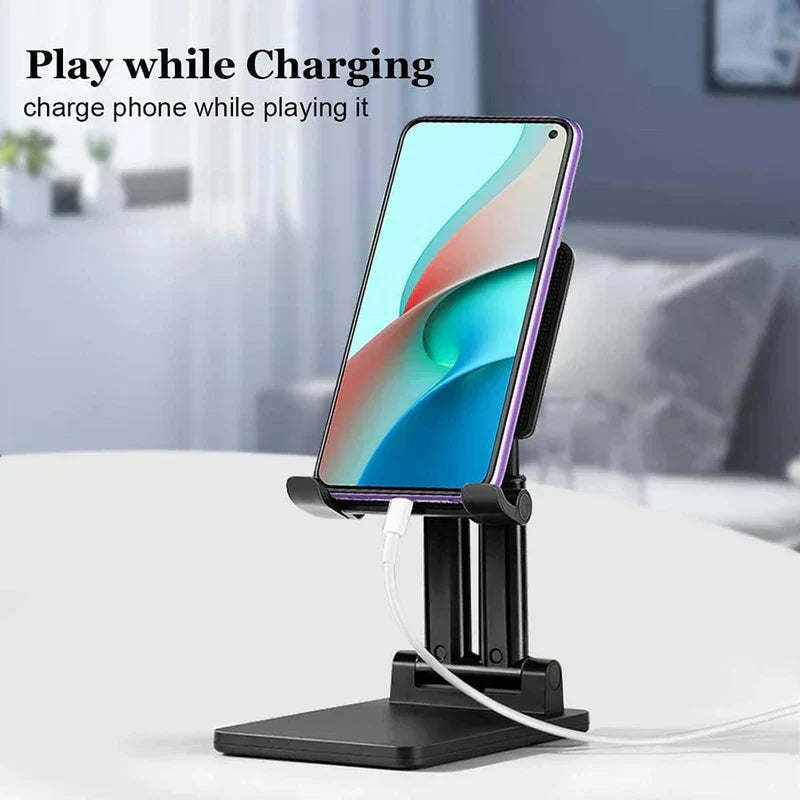 Mobile Device Desk Stand - Smartphone on a black stand charging via bottom port on a white table