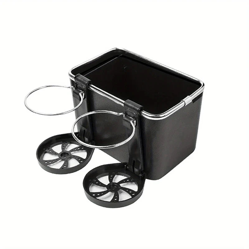 Black car armrest storage box with two foldable cup holders on white background