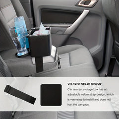 Car armrest storage box with velcro strap and cup holders in vehicle interior