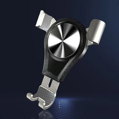 Cell Phone Stand - silver and black holder with metallic center disc on dark blue textured background