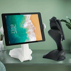 Phone Tablet Stand - white and black device stands holding tablets on a green desk