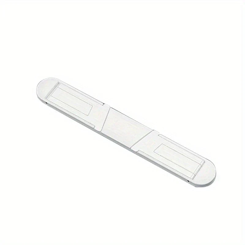 Portable Laptop Stand - White elongated plastic piece with rounded ends and symmetrical recessed rectangular sections on both ends