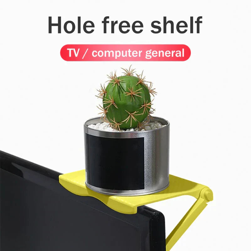 Adjustable Monitor Stand Riser - Yellow shelf mounted on monitor top holding a potted cactus