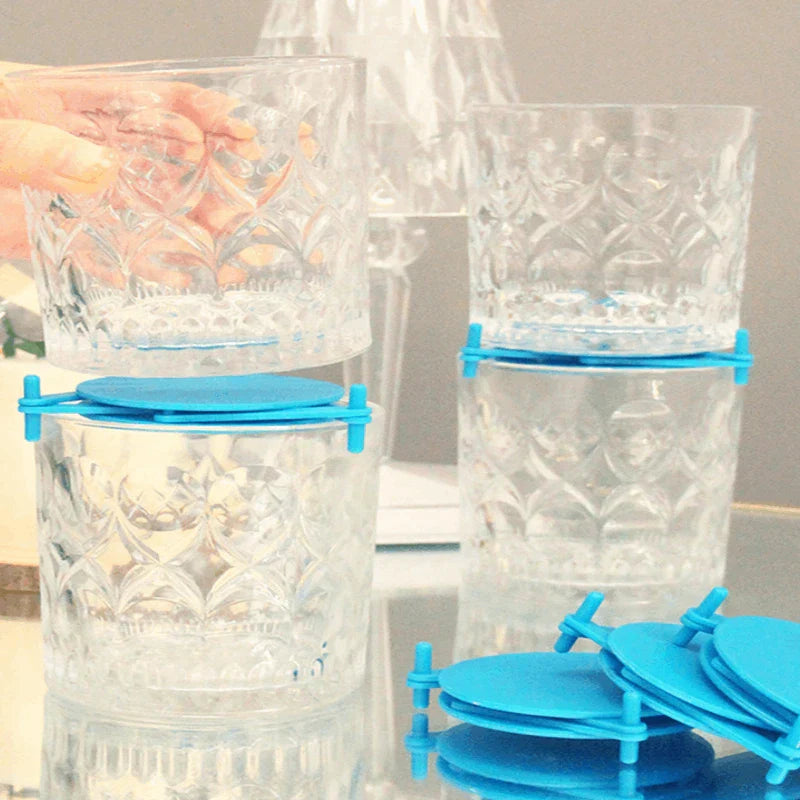 Shelf Organizer Rack - Stacked clear glass tumblers held apart by blue stacking inserts on a countertop