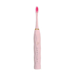 Toothbrush Kit - Single light pink electric toothbrush with pink brush head and gold accent ring on white background