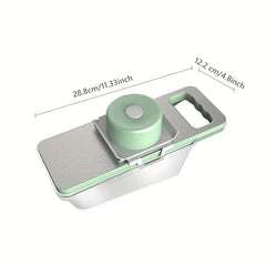 Vegetable slicer with clear catch container, green hand guard, and stainless steel top, with length and width dimension labels