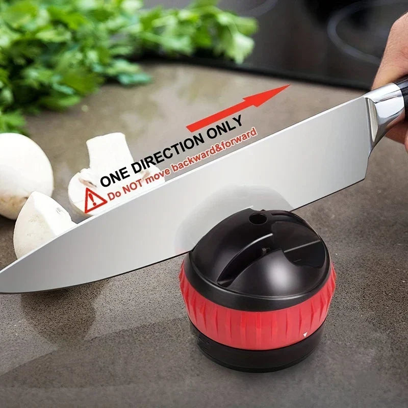 Knife Sharpener System - Knife sharpener resting on a kitchen counter with a chef's knife across its slots, and text noting one-direction only use, no back-and-forth movement