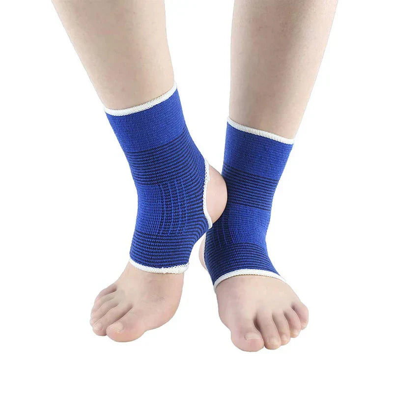 Pair of feet wearing a blue open-heel ankle brace, one foot resting against the other ankle, on white background