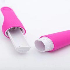 Facial Tool - Two pink and white cylindrical device sections pulled apart, revealing inner white plastic and threaded end