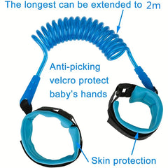 Wrist Link - Blue coiled wrist leash with two padded cuffs, labeled with max 2m extension, anti-picking velcro, skin protection