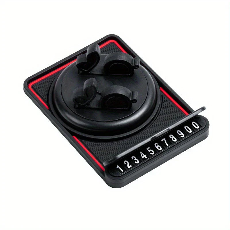 Dashboard Pad - Black car phone mount with two black clip holders on a swivel base, and a partially extended number plate strip.