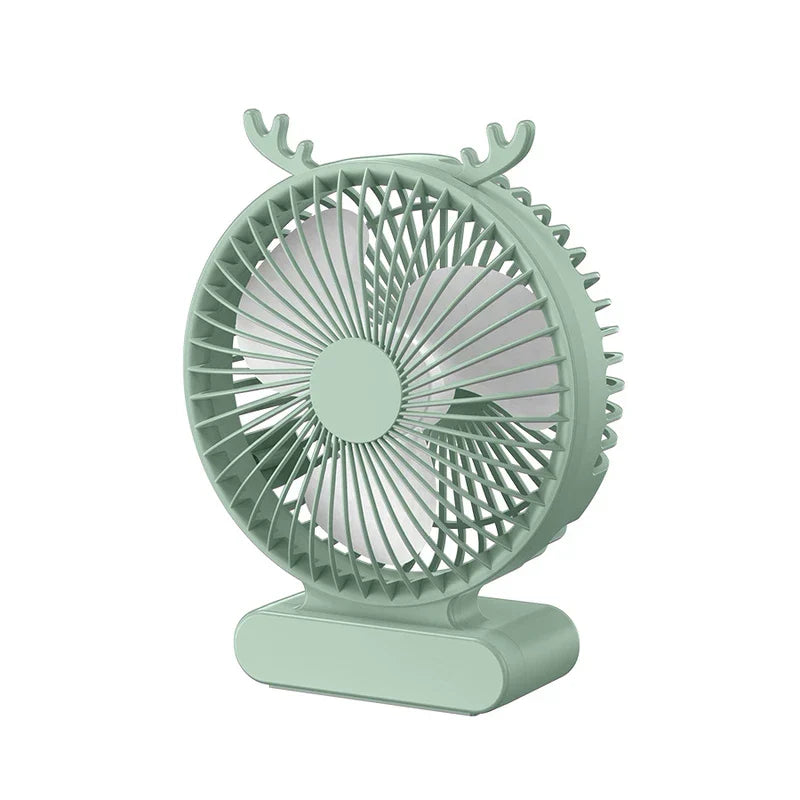 A mint green usb desktop fan with small antler-shaped accents on top, set against a plain white background.