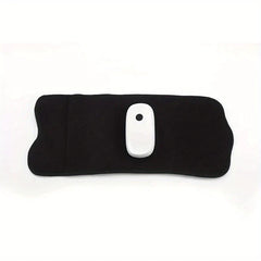 Compression Massager - flat lay of black fabric massage wrap with white control module on white background