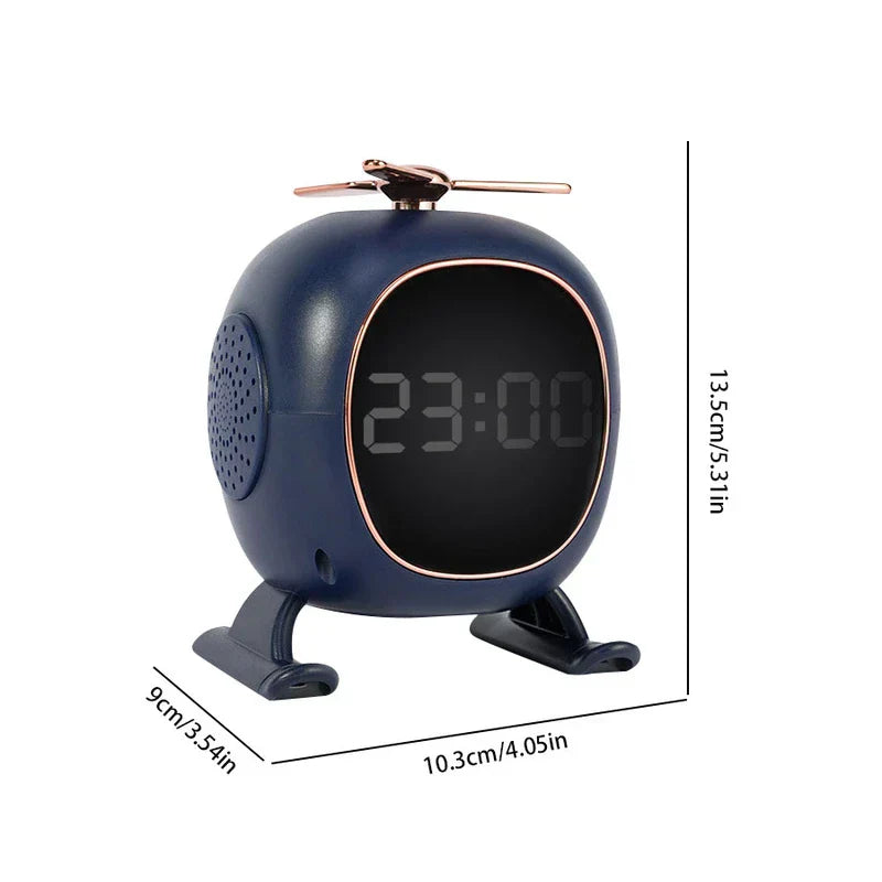 Navy blue helicopter-shaped digital alarm clock with rose gold accents, dimensions 13.5cm x 10.3cm x 9cm