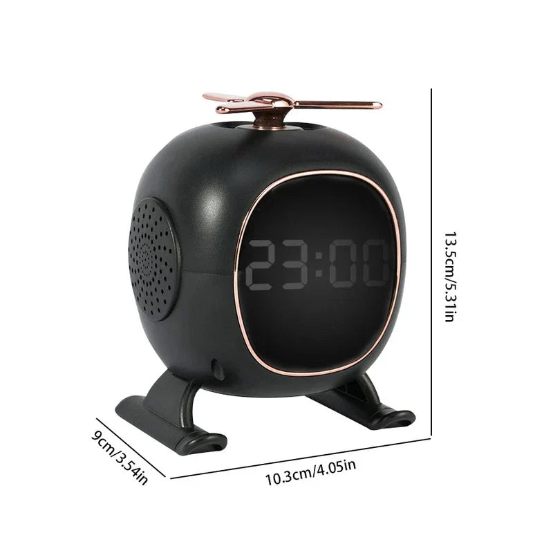 Black helicopter-shaped digital alarm clock with rose gold accents, dimensions 13.5cm x 10.3cm x 9cm