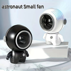 ventilador de cuello sin aspas - Ventiladores pequeños con forma de astronauta en blanco y negro exhibidos sobre una superficie de mármol