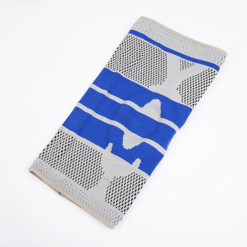 Knee Support Sleeve - Flat laid knee sleeve with gray, blue, and black knit pattern on white background