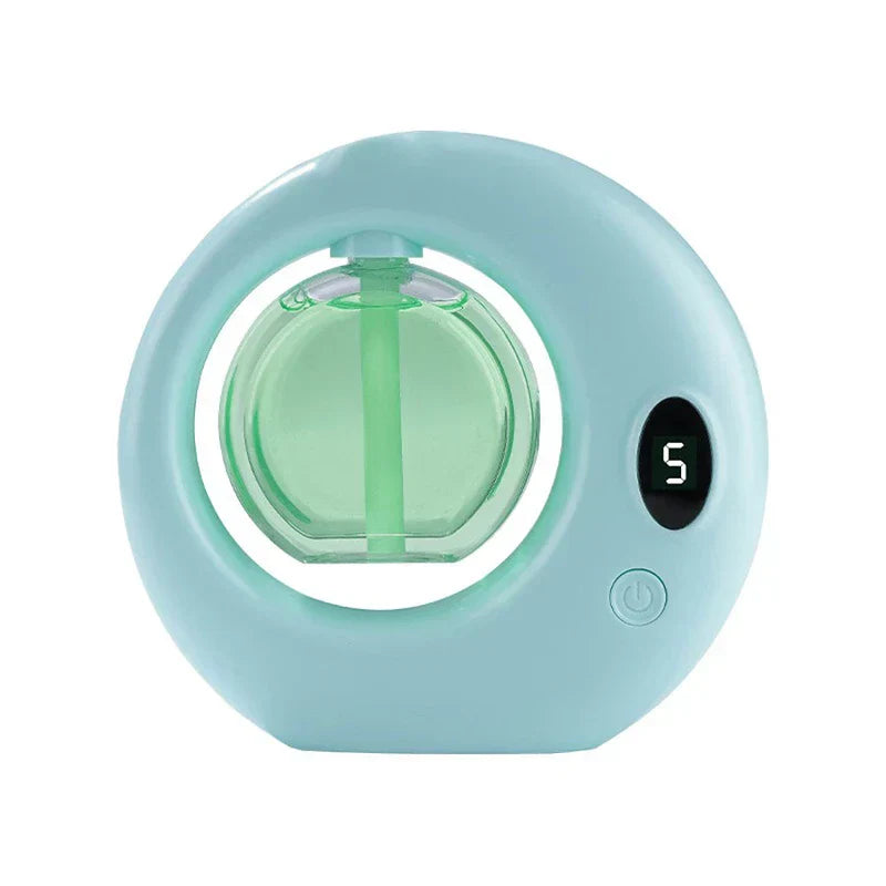 Automatic aerosol air freshener dispenser machine mounted on a wall in a modern bathroom