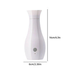 Perfume Machine - White vase-shaped device with gray power button and 16cm x 6cm size labels