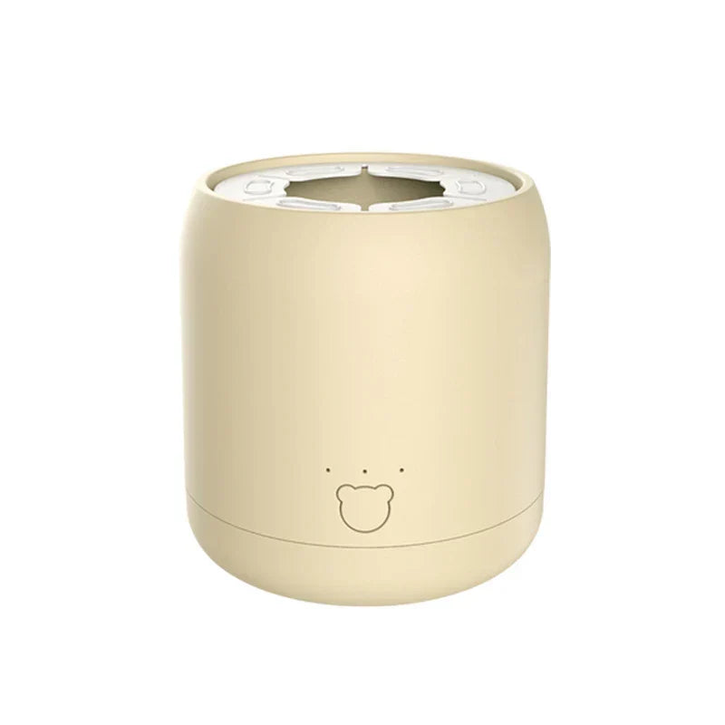 Milk Shaker - beige cylindrical device with bear face detail on white background