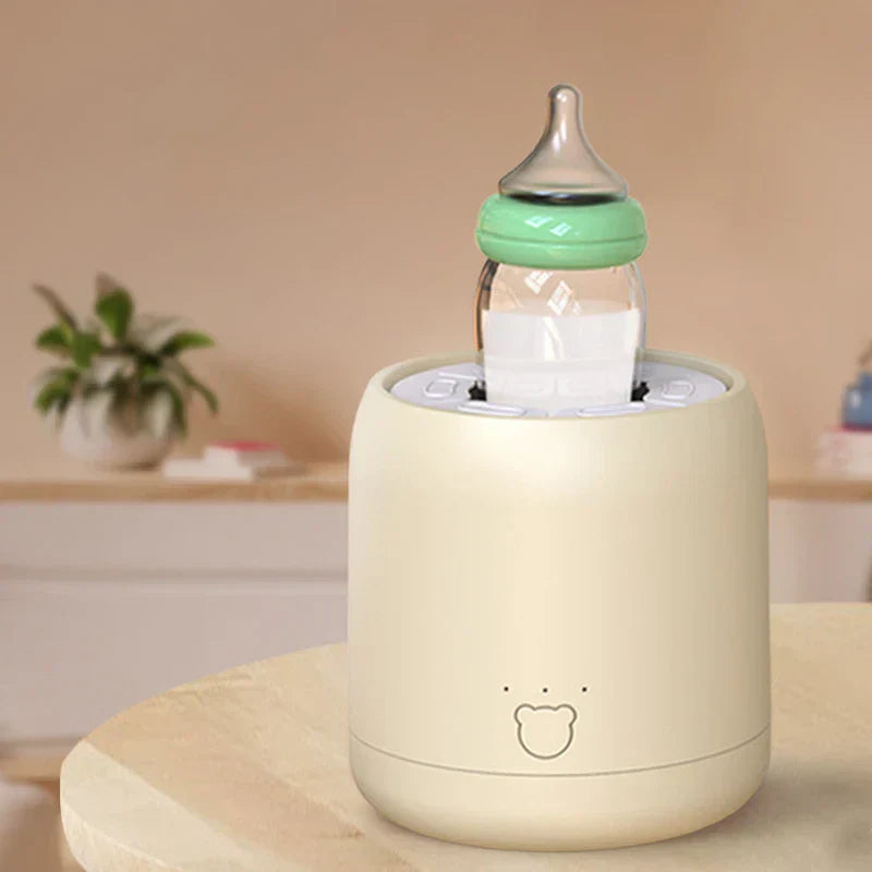 Milk Shaker - beige device holding a baby bottle on a wooden table