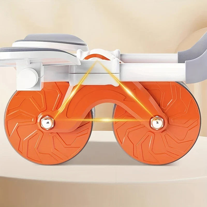 Ab Roller Wheel - Close-up of orange dual-wheel ab roller with white frame, gray elbow pads, and yellow structural highlight lines.