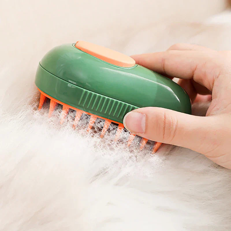 Pet Grooming Brush - A hand holds a green and orange pet brush through white fluffy fur with foam on the bristles.
